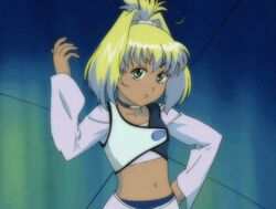  00s animated animated bandai blonde_hair breasts dark_skin female female geneshaft green_eyes long_hair looking_at_viewer ponytail shiny small_breasts solo talking tiki_musicanova 