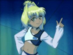  00s animated animated bandai blonde_hair breasts dark_skin female female geneshaft green_eyes happy long_hair looking_at_viewer naughty_face ponytail shiny small_breasts smile solo talking tiki_musicanova 