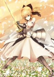  ahoge armor armored_dress artoria_pendragon_(fate) black_bow blonde_hair bow caliburn_(fate) commentary detached_sleeves dress fate/stay_night fate/unlimited_codes fate_(series) female flower green_eyes hairbow highres kaze_minoru_so-ru long_dress long_skirt petals saber_lily skirt solo sword weapon 