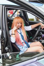  ai_(a-messe) blue_skirt bracelet brown_eyes car car_interior collared_shirt colored_inner_hair commentary_request cosplay_photo female grey_nails gyaru highres jewelry kitagawa_marin kogal long_hair motor_vehicle multicolored_hair one_eye_closed orange_hair photo_(medium) pink_hair plaid plaid_skirt real_life red_lips right-hand_drive second-party_source shirt sitting skirt smile solo sono_bisque_doll_wa_koi_wo_suru steering_wheel v white_shirt 