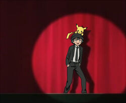  1boy :d black_footwear black_headwear black_jacket black_necktie black_pants collared_shirt commentary_request grey_shirt hat jacket kanimaru kekkai_sensen looking_up male_focus necktie on_head open_mouth pants parody pikachu pokemon pokemon_(anime) pokemon_(creature) pokemon_on_head satoshi_(pokemon) shirt shoes short_hair smile spotlight stage standing sugar_song_and_bitter_step 