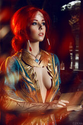  blue_eyes book breasts circlet cosplay costume dress female freckles helly_von_valentine_(disharmonica) indoors jewelry long_hair looking_afar makeup medium_breasts necklace no_bra parted_lips pendant photo red_hair robe side_braids solo the_witcher triss_merigold upper_body 