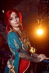  blue_eyes breasts circlet cosplay costume dress female freckles helly_von_valentine_(disharmonica) indoors jewelry large_breasts long_hair looking_afar makeup necklace no_bra pendant photo railing red_hair robe side_braids solo the_witcher triss_merigold upper_body 