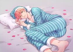  1boy ass barefoot commentary_request fate/grand_order fate_(series) fujinari_takumi green_eyes hat lying male_focus nightcap on_side pajamas petals pillow pink_hair romani_archaman smile solo striped 