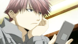  1boy anime_screenshot bus_gamer cellphone male_focus mishiba_toki phone red_hair solo 