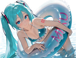  absurdres aqua_eyes aqua_hair bent_over bikini blue_bikini blush collarbone female frilled_bikini frills hatsune_miku highres inflatable_toy long_hair looking_at_viewer ocean solo standing swimsuit twintails very_long_hair vocaloid wuhe2233pz 
