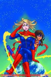  2014 2girls animification blonde_hair bodysuit boots breasts brown_eyes brown_hair captain_marvel carol_danvers comic_cover cover cover_page crossed_legs dark-skinned_female dark_skin domino_mask earth_(planet) giant giantess gloves green_eyes kamala_khan knee_boots lips long_hair marvel mask medium_breasts ms._marvel ms._marvel_(series) multiple_girls official_art planet red_gloves salute scarf sitting smile superhero_costume tateo_retsu v 