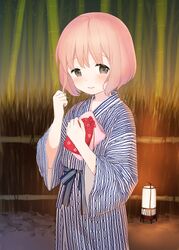  bamboo bath_yukata blush brown_eyes commentary_request female japanese_clothes kimono kinchaku lantern outdoors pink_hair playing_with_own_hair pouch sekiya_asami shima_(pattern) short_hair smile solo standing towel yukata 