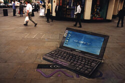  anamorphism bag black_pants chalk computer grocery_bag holding holding_bag icon_(computing) julian_beever keyboard_(computer) laptop lowres original pants people photo_(medium) road shirt shopping_bag sony street traditional_media vaio white_shirt windows_logo 