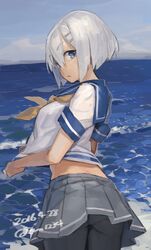  ass beach black_pantyhose blue_eyes clothes_lift commentary_request crop_top crop_top_overhang dated female from_behind hair_ornament hairclip hamakaze_(kancolle) kantai_collection looking_back midriff ocean outdoors panties panties_under_pantyhose pantyhose pleated_skirt school_uniform serafuku short_hair short_sleeves skirt skirt_lift solo toro_(konirio) underwear white_hair wind wind_lift 