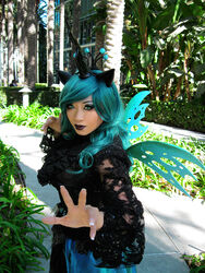 3:4 alternative_fashion arthropod changeling clothed clothing cosplay cosplay_lolita dress female friendship_is_magic goth gothic_lolita green_eyes green_hair hair hasbro hi_res insect_wings j-fashion lips lolita_(fashion) long_hair makeup my_little_pony nails outside queen_chrysalis_(mlp) solo standing wings yaya_han