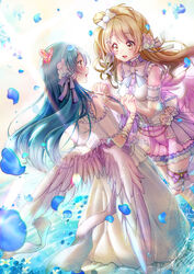  2girls angel_wings blue_hair blush butterfly_hair_ornament commentary_request feathered_wings flower frills grey_hair hair_between_eyes hair_flower hair_ornament holding_hands interlocked_fingers long_hair looking_at_another love_live! love_live!_school_idol_festival love_live!_school_idol_project maronie. minami_kotori multiple_girls one_side_up open_mouth petals sleeveless smile sonoda_umi standing standing_on_liquid water wings yellow_eyes 