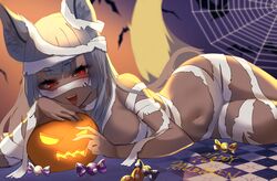  absurdres animal_ear_fluff animal_ears bat_(animal) blue_eyeshadow breasts candy checkered_floor commission dark-skinned_female dark_skin eyeshadow female food happy_halloween highres indie_virtual_youtuber jack-o&#039;-lantern long_hair lying makeup mummy_costume nairu_nirvana nidoneane on_side open_mouth red_eyes second-party_source silk skeb_commission solo spider_web teeth upper_teeth_only virtual_youtuber wrapped_candy 