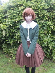  1boy alternate_eye_color artist_request bangs black_legwear blue_eyes brown_hair brown_skirt cosplay danganronpa danganronpa_1 female fujisaki_chihiro fujisaki_chihiro_(cosplay) grass kneehighs leaf leaves light_smile lips looking_at_viewer non-asian nose outdoors photo pleated_skirt school_uniform short_hair skirt smile solo swept_bangs trap upper_body v white_skin wig 