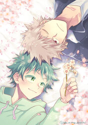  2boys arm_behind_head bakugou_katsuki blonde_hair boku_no_hero_academia cherry_blossoms flower freckles green_eyes green_hair green_hoodie highres holding holding_flower hood hoodie lying male_focus midoriya_izuku multiple_boys on_back one_eye_closed petals red_eyes smile spiked_hair twitter_username ume_(326310) yaoi 