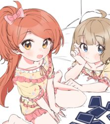  2girls :d :t absurdres ahoge arm_rest barefoot bed_sheet between_legs blue_eyes blunt_bangs blunt_ends blush bow card clenched_hand closed_mouth collarbone dot_nose drawstring elbow_rest eyes_visible_through_hair floral_print frilled_sleeves frills from_above from_side hairbow hand_between_legs head_rest highres idolmaster idolmaster_million_live! indoors light_brown_hair long_hair looking_at_viewer looking_to_the_side looking_up lying matching_outfits meeeeeeco359 multiple_girls ogami_tamaki on_bed on_stomach one_side_up open_mouth orange_eyes pajamas pink_bow playing_card puffy_short_sleeves puffy_sleeves red_hair short_hair short_sleeves sitting sleepover sleepwear smile suou_momoko swept_bangs v_arms wariza 