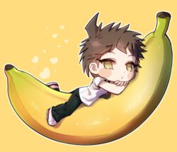  1boy ahoge banana black_pants blush_stickers brown_eyes brown_hair chibi commentary_request danganronpa_(series) danganronpa_2:_goodbye_despair food fruit full_body gwanlamcha hinata_hajime korean_commentary looking_at_viewer lying male_focus on_stomach pants shirt shoes short_hair simple_background solo white_shirt yellow_background yellow_eyes 