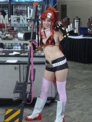  belt bikini_top boots breasts cosplay elbow_gloves ellarcy fingerless_gloves gloves gun long_hair medium_breasts photo ponytail red_hair short_shorts shorts skull solo studded_belt tengen_toppa_gurren_lagann thighhighs underboob weapon yoko_littner 