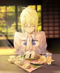  ahoge artoria_pendragon_(fate) bad_hands blonde_hair blue_ribbon braid braided_bun chopsticks closed_eyes closed_mouth commentary e_(h798602056) fate/stay_night fate_(series) female food hair_between_eyes hair_bun hair_ribbon highres holding indoors neck_ribbon own_hands_together praying ribbon saber_(fate) shirt short_hair sidelocks sitting solo upper_body white_shirt 