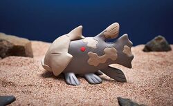  clay_(medium) closed_eyes closed_mouth commentary_request fish from_side full_body morii_yuka no_humans official_art photo_(medium) pokemon pokemon_(creature) pokemon_tcg profile relicanth rock sand solo third-party_source unconventional_media 