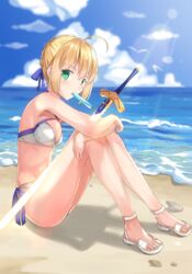  ahoge artoria_pendragon_(fate) artoria_pendragon_(swimsuit_archer)_(fate) artoria_pendragon_(swimsuit_archer)_(first_ascension)_(fate) bad_id bad_pixiv_id bikini blonde_hair blue_ribbon blurry blurry_background braid braided_bun breasts cleavage criss-cross_halter day excalibur_(fate/stay_night) fate/grand_order fate_(series) feet female full_body green_eyes hair_bun hair_ribbon halterneck highres lens_flare looking_at_viewer mouth_hold ocean outdoors ribbon sandals shokuyou_koori short_hair side-tie_bikini_bottom sitting small_breasts solo sunlight swimsuit water white_bikini white_footwear 