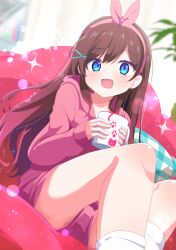  absurdres blue_eyes blush brown_hair commission cup female hair_ornament hairband highres holding holding_cup hood hooded_jacket indoors jacket looking_at_viewer open_mouth original pillow pink_hairband shiro9jira short_shorts shorts sitting skeb_commission smile socks solo white_socks x_hair_ornament 