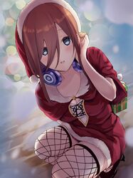  absurdres adjusting_hair blue_eyes blurry blurry_background breasts brown_hair christmas christmas_tree cleavage female fishnet_thighhighs fishnets gift go-toubun_no_hanayome hair_between_eyes hat headphones headphones_around_neck highres long_hair nakano_miku nyorotono_(amafurashi) santa_costume santa_hat solo squatting thighhighs 