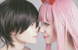  1boy bangs black_hair blue_eyes cosplay couple darling_in_the_franxx face-to-face facing_another female forehead-to-forehead green_eyes hiro_(darling_in_the_franxx) hiro_(darling_in_the_franxx)_(cosplay) horns long_hair looking_at_another oni_horns pink_hair red_horns shirtless straight zero_two_(darling_in_the_franxx) zero_two_(darling_in_the_franxx)_(cosplay) 