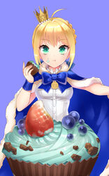  ahoge alternate_costume artoria_pendragon_(fate) blonde_hair blue_cape blueberry bow cape commentary_request crown cupcake eating fate/stay_night fate_(series) female food food_on_face fruit green_eyes highres momoayamo saber_(fate) solo strawberry 