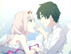  1boy bad_id bad_twitter_id black_hair candy closed_eyes commentary couple darling_in_the_franxx feeding female food green_eyes highres hiro_(darling_in_the_franxx) holding holding_candy holding_food horns leje39 long_hair looking_at_another lying lying_on_person nightgown pillow pink_hair shirt straight white_shirt zero_two_(darling_in_the_franxx) 