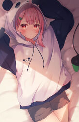  animal_hood bed_sheet blush brown_shorts female hair_ornament hairclip highres hood hoodie leopon_pon looking_at_viewer lying nijisanji on_back on_bed panda_hood pink_hair raglan_sleeves sasaki_saku sasaki_saku_(1st_costume) shorts solo two-tone_hoodie virtual_youtuber white_hoodie 