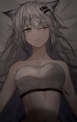  ;) animal_ears arknights bandeau bare_shoulders bed_sheet breasts collarbone commentary female grey_eyes grey_hair hair_between_eyes hair_ornament hairclip highres kiyakyuu lappland_(arknights) large_breasts long_hair looking_at_viewer lying material_growth midriff on_back one_eye_closed oripathy_lesion_(arknights) scar scar_across_eye scar_on_face smile solo stomach strapless tube_top upper_body wolf_ears 