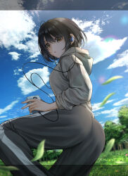  ass black_hair daiko_(dai1974910) earphones falling_leaves female grass grey_hoodie grey_pants highres hood hoodie idolmaster idolmaster_cinderella_girls leaf looking_at_viewer looking_to_the_side outdoors pants short_hair solo standing standing_on_one_leg takafuji_kako 