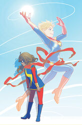  2girls blonde_hair blue_eyes bodysuit boots bracer brown_eyes brown_hair captain_marvel carol_danvers dark_skin domino_mask gloves kamala_khan marvel mask ms._marvel multiple_girls sash scarf skimlines 