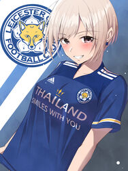  adidas blonde_hair blue_background blue_shirt blush breasts brown_eyes clothes_writing collarbone commentary earrings female grin highres idolmaster idolmaster_cinderella_girls jewelry leicester_city_fc logo looking_at_viewer medium_breasts parted_bangs premier_league shiomi_syuko shirt short_hair short_sleeves sidelocks smile soccer_uniform solo sportswear standing teeth trait_connection two-tone_background upper_body white_background yoshimoto_(carpsukidayo) 