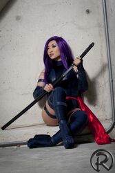  cosplay female high_heels katana long_boots marvel photo psylocke purple_hair sitting solo sword thighhighs weapon x-men yaya_han 