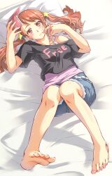  anjou_naruko ano_hi_mita_hana_no_namae_wo_bokutachi_wa_mada_shiranai. ayano_naoto bare_shoulders barefoot bed_sheet blush brown_eyes brown_hair casual commentary_request feet female foreshortening game_boy_advance_sp handheld_game_console holding lying nail_polish off_shoulder on_back pillow shirt shorts soles solo t-shirt toenail_polish toenails toes twintails twirling_hair 