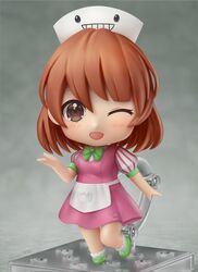  artist_name blush bow brown_eyes brown_hair chibi commission faux_figurine female full_body green_bow green_footwear highres nendoroid one_eye_closed open_mouth original second-party_source shiori2525 short_hair short_sleeves smile solo 