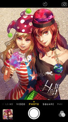  2girls american_flag_dress arm_around_shoulder black_shirt blonde_hair chains clothes_writing clownpiece collar collarbone commentary_request earth_(ornament) fake_phone_screenshot fake_screenshot gold_chain gradient_eyes hat hecatia_lapislazuli highres jester_cap lips long_hair looking_at_viewer moon multicolored_clothes multicolored_eyes multicolored_skirt multiple_girls nose open_mouth photoshop_(medium) purple_eyes red_eyes red_hair selfie shirt short_hair side-by-side skirt smile sunyuqian teeth torch touhou viewfinder 