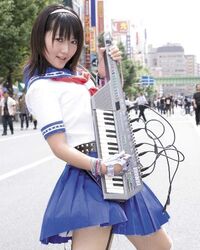  cosplay cosplay_photo female instrument keytar lowres momoi_haruko photo_(medium) real_life school_uniform solo voice_actor 