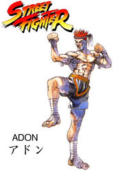  adon adon_(street_fighter) bengus boxing capcom evil_smile game knee knees muai_thai muscle official_art oldschool red_hair shorts smile street_fighter street_fighter_1 