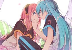  2girls :t blue_eyes blue_hair commentary eye_contact hairband hand_on_another&#039;s_chin hatsune_miku heads_together heart kuudere leaning_forward long_hair looking_at_another megurine_luka multiple_girls nail_polish pants pillow pink_hair short_sleeves sitting straight_hair track_pants twintails twitter_username very_long_hair vocaloid wanaxtuco yuri 