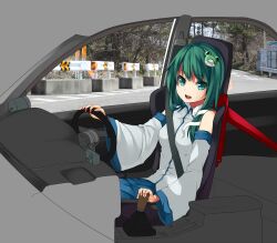  car car_interior commentary_request detached_sleeves driving female frog_hair_ornament green_eyes green_hair hair_ornament kochiya_sanae long_hair motor_vehicle open_mouth photo_background right-hand_drive snake_hair_ornament solo steering_wheel touhou unasaka_ryou wide_sleeves 