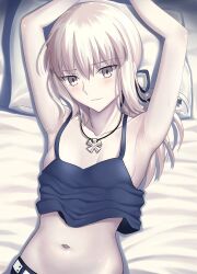  absurdres arms_up artoria_pendragon_(fate) blonde_hair breasts closed_mouth crop_top fate/stay_night fate_(series) female highres jewelry long_hair longdq3008 looking_at_viewer lying navel necklace on_back on_bed pillow saber_alter small_breasts solo stomach upper_body yellow_eyes 