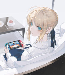  ahoge animal_crossing aqua_eyes artoria_pendragon_(fate) blonde_hair braid coffee_table commentary couch cup dress fate/stay_night fate_(series) female from_behind hair_ribbon handheld_game_console holding holding_handheld_game_console looking_at_viewer looking_back nintendo_switch playing ribbon saber_(fate) saucer sitting solo spoon symbol-only_commentary table tea teacup wanke white_background 