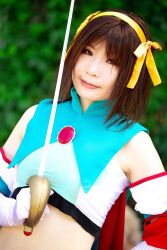  armband cape cosplay hair_ribbon hair_ribbons halter_top halterneck highres midriff ousawa_karin photo ribbon suzumiya_haruhi suzumiya_haruhi_no_tomadoi suzumiya_haruhi_no_yuuutsu sword weapon 