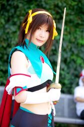  armband cape cosplay hair_ribbon hair_ribbons halter_top halterneck highres midriff ousawa_karin photo ribbon suzumiya_haruhi suzumiya_haruhi_no_tomadoi suzumiya_haruhi_no_yuuutsu sword weapon 