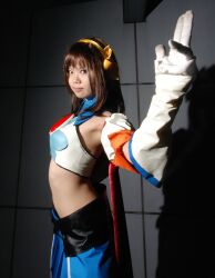  cape cosplay elbow_gloves gloves hair_ribbon hair_ribbons halter_top halterneck highres midriff photo pleated_skirt ribbon skirt suzumiya_haruhi suzumiya_haruhi_no_tomadoi suzumiya_haruhi_no_yuuutsu taku_anko 