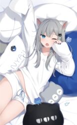  absurdres alternate_costume amashiro_natsuki animal_ears bad_id bad_pixiv_id black_nails blue_eyes cat-shaped_pillow cat_ears cat_girl commentary eyebrows_hidden_by_hair female grey_hair highres indie_virtual_youtuber nachoneko nail_polish one_eye_closed paw_hair_ornament petite short_shorts shorts sleepwear sleepy sleeves_past_fingers sleeves_past_wrists solo symbol-only_commentary thighs virtual_youtuber 