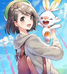  :d ;d backpack bag black_hair blue_sky blush brown_eyes brown_hair coat commentary_request day dutch_angle female from_side gloria_(pokemon) green_headwear grey_coat hat holding holding_pokemon hood hood_down hooded_coat lens_flare long_sleeves looking_at_viewer looking_to_the_side one_eye_closed open_mouth orange_eyes outdoors pokemon pokemon_(creature) pokemon_swsh revision scorbunny short_hair sky smile tam_o&#039;_shanter upper_body yuduki_(tt-yuduki) 